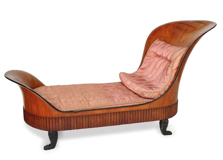 An Italian Neoclassical carved, veneered and ebonized cherry wood day-bed